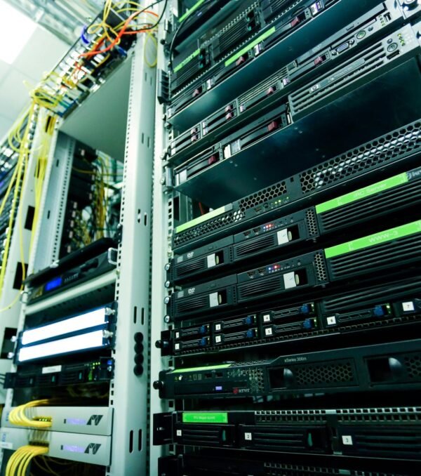 High-tech server rack in a secure data center with network cables and hardware components.